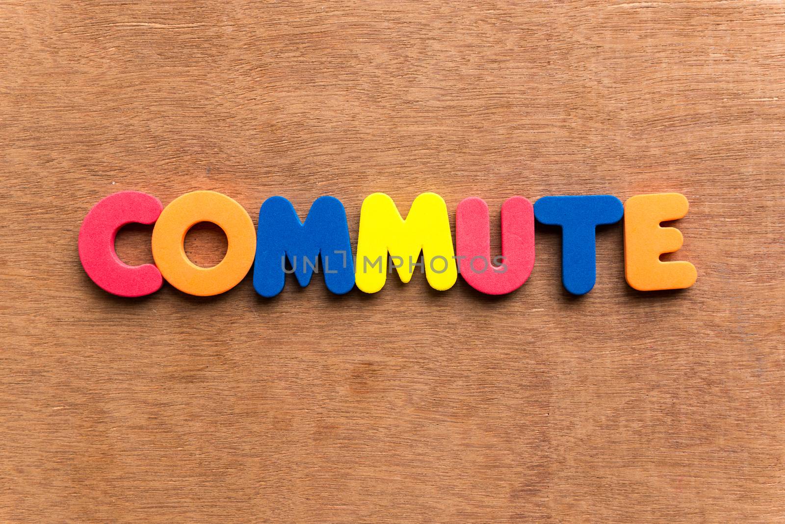commute colorful word on the wooden background