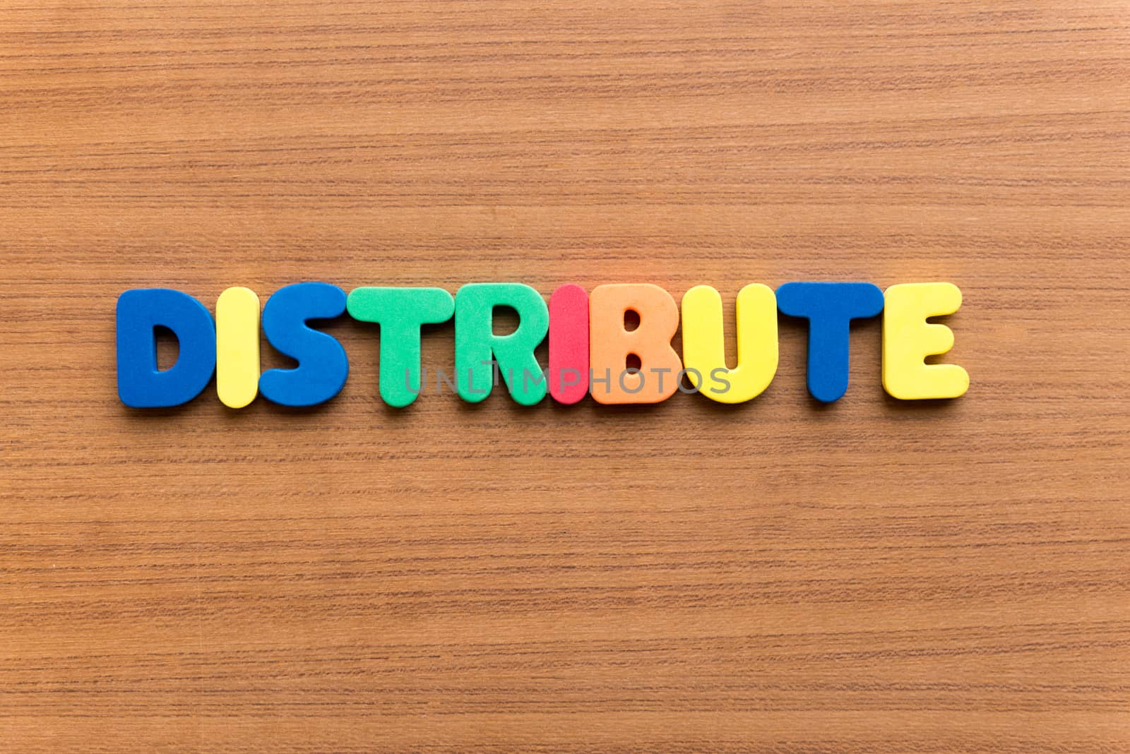 distribute colorful word on the wooden background