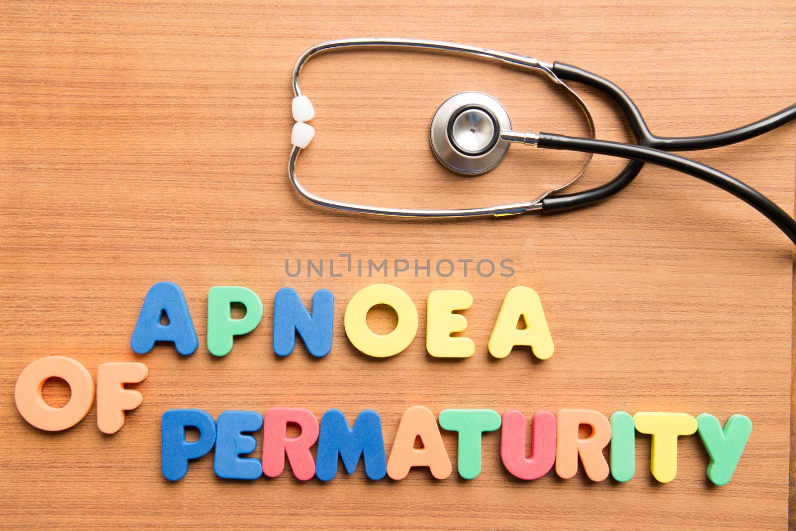 Apnoea of prematurity colorful word with stethoscope on the wooden background