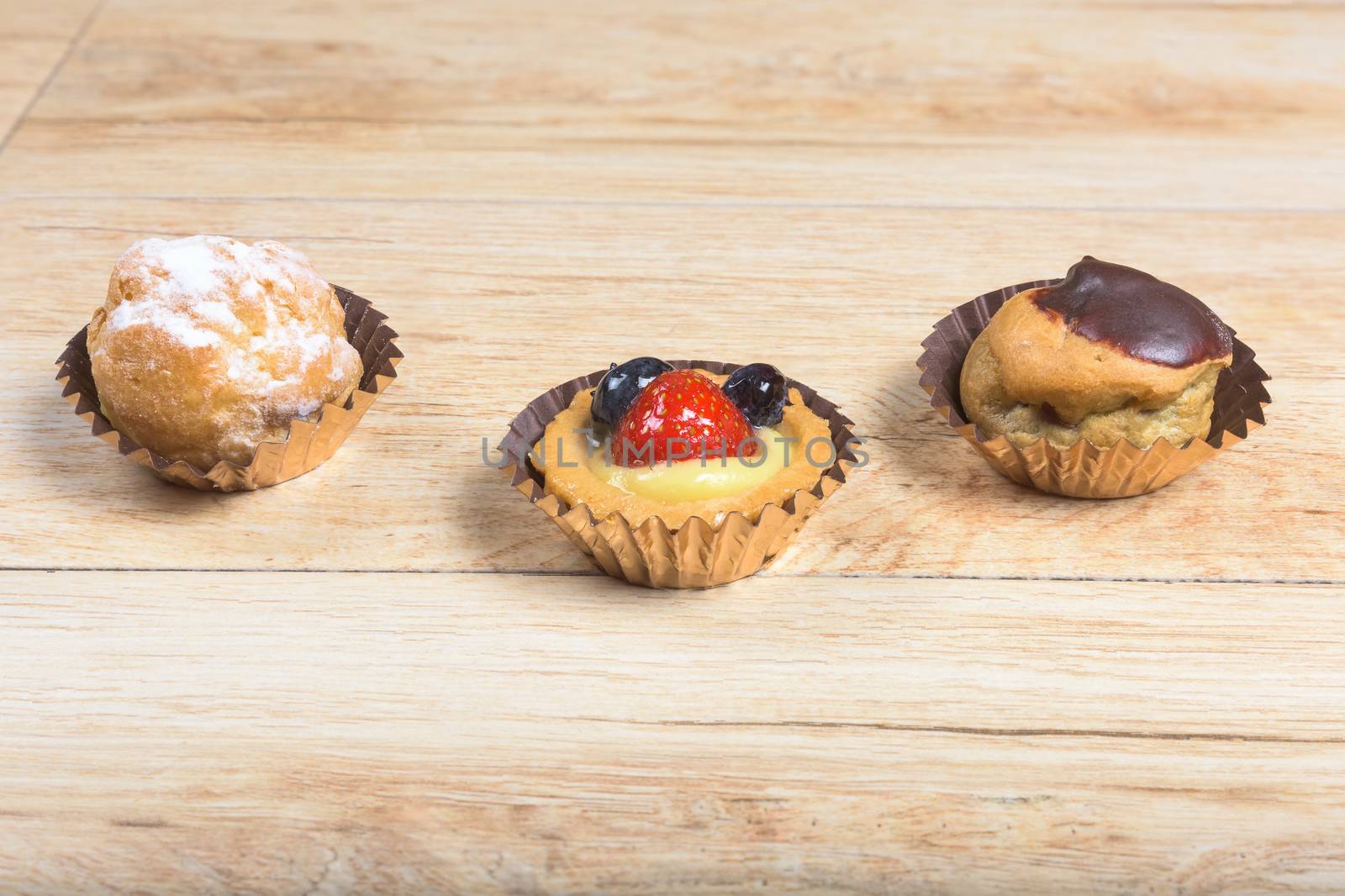 Pictured pastries on light wood background.