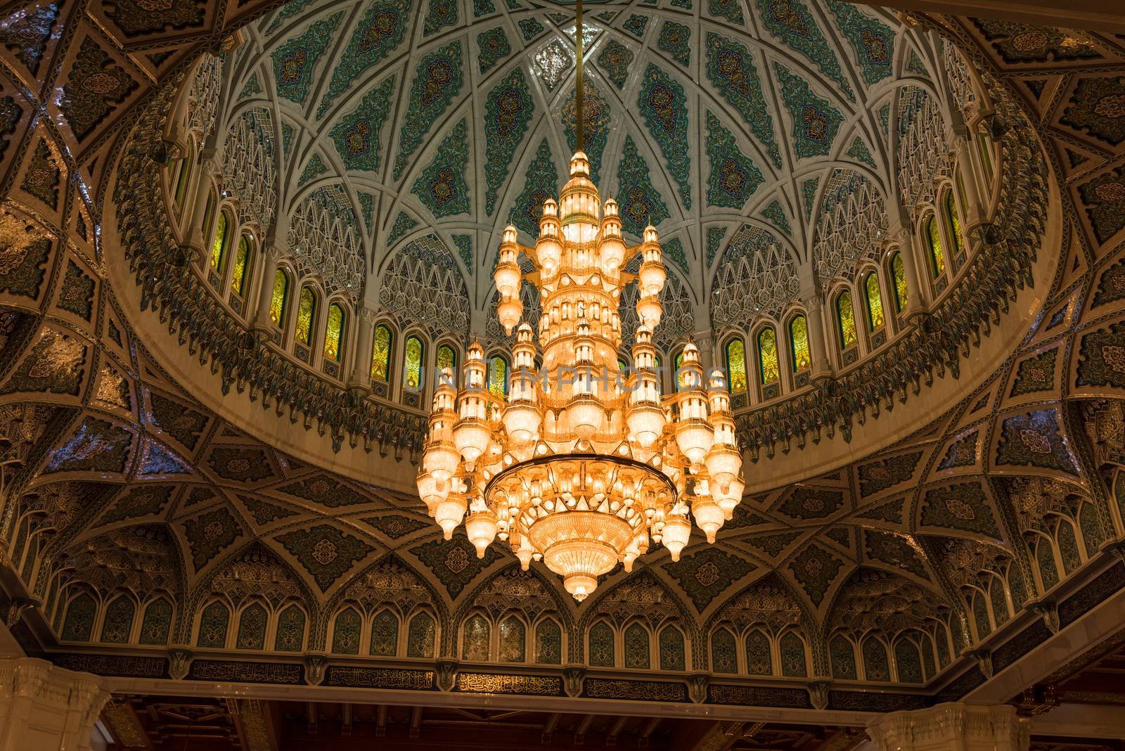 Muscat, Oman - February 28, 2016: The chandelier and inside of the dome of Sultan Qaboos Grand Mosque in Muscat, Oman. This is the largest and most decorated mosque in this mostly Muslim country.