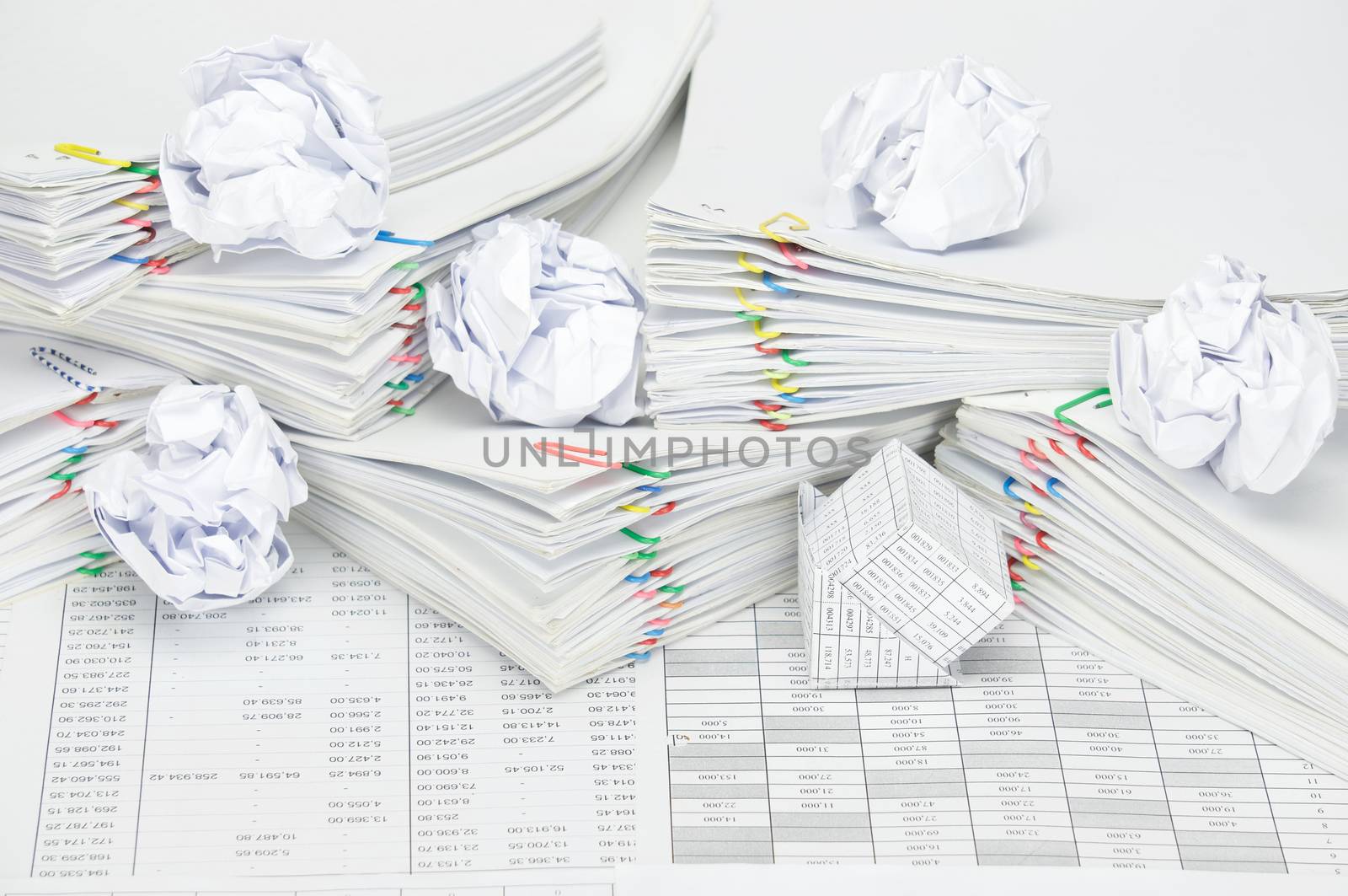 Bankruptcy of house with paper ball on pile overload paperwork by eaglesky