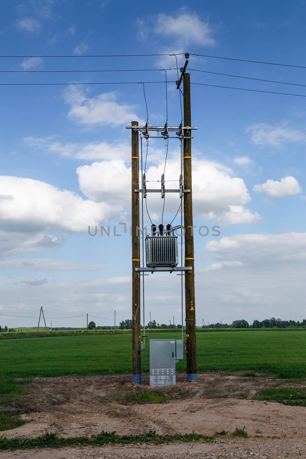 electric pole in a field with a wardrobe