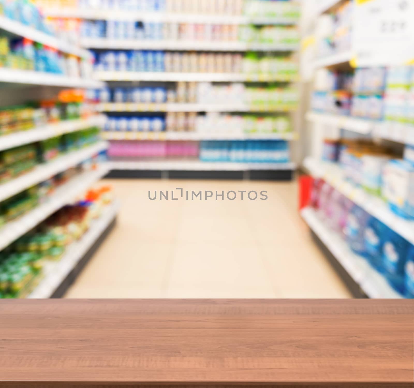 Wooden board empty table in front of blurred background. Perspective dark wood table over blur in kids toy store. Mock up for display or montage your product.