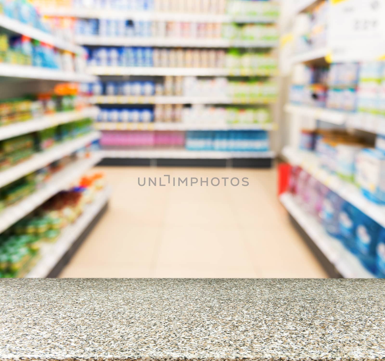 Marble board empty table in blurred kids toy store by fascinadora