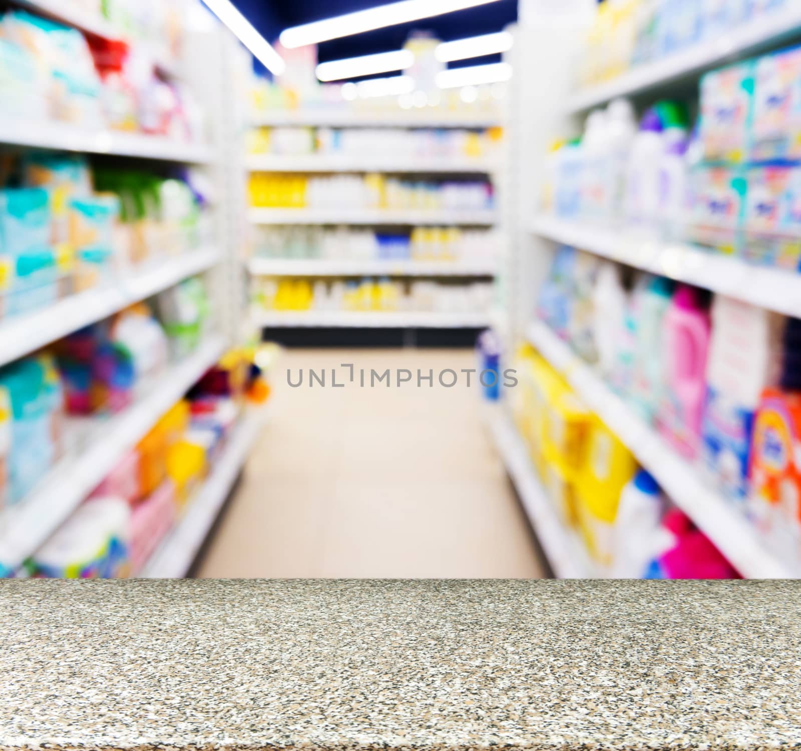 Marble board empty table in blurred kids toy store by fascinadora