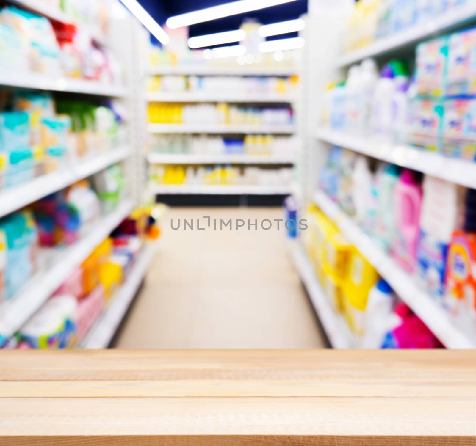 Wooden empty table in blurred of kids toy store by fascinadora