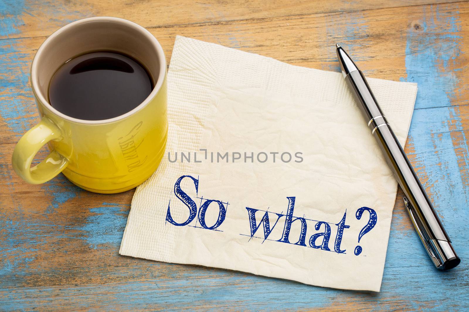 So what question - indifference concept - handwriting on a napkin with a cup of espresso coffee