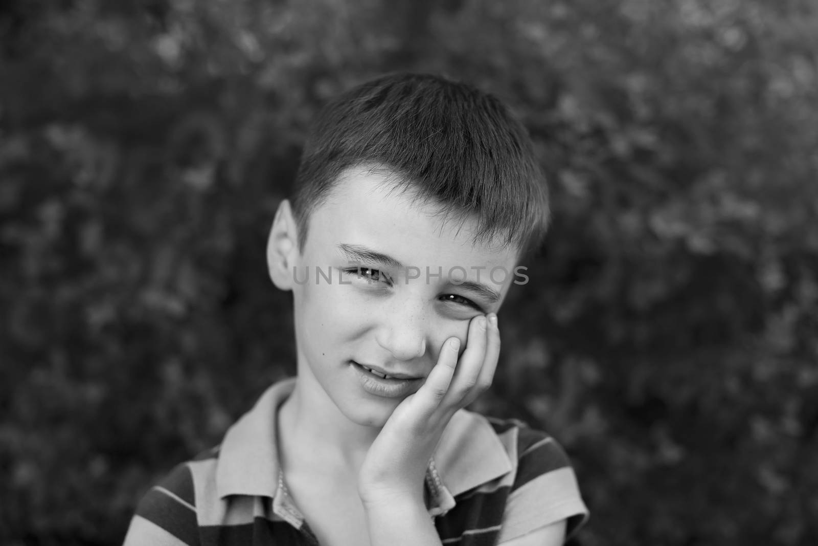 Portrait of a boy close up in nature