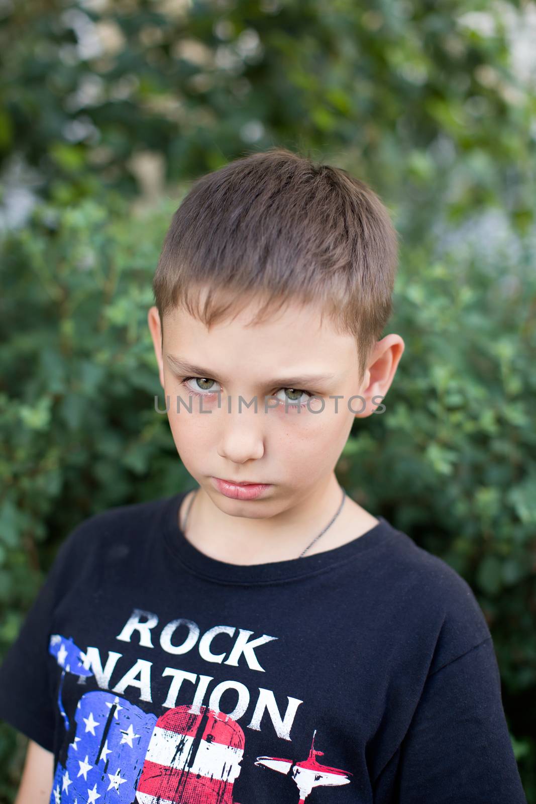 Portrait of a boy close up in nature