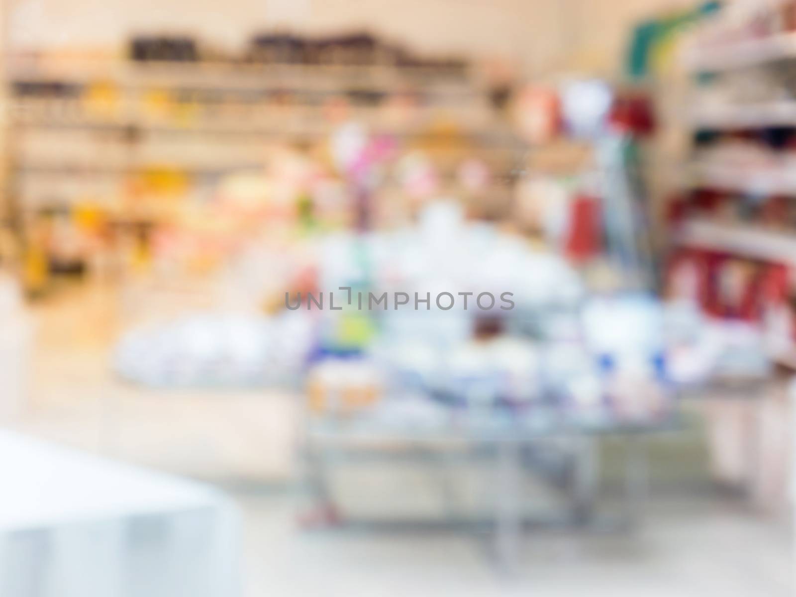 Blurred colorful products in abstract shop - background with shallow DOF