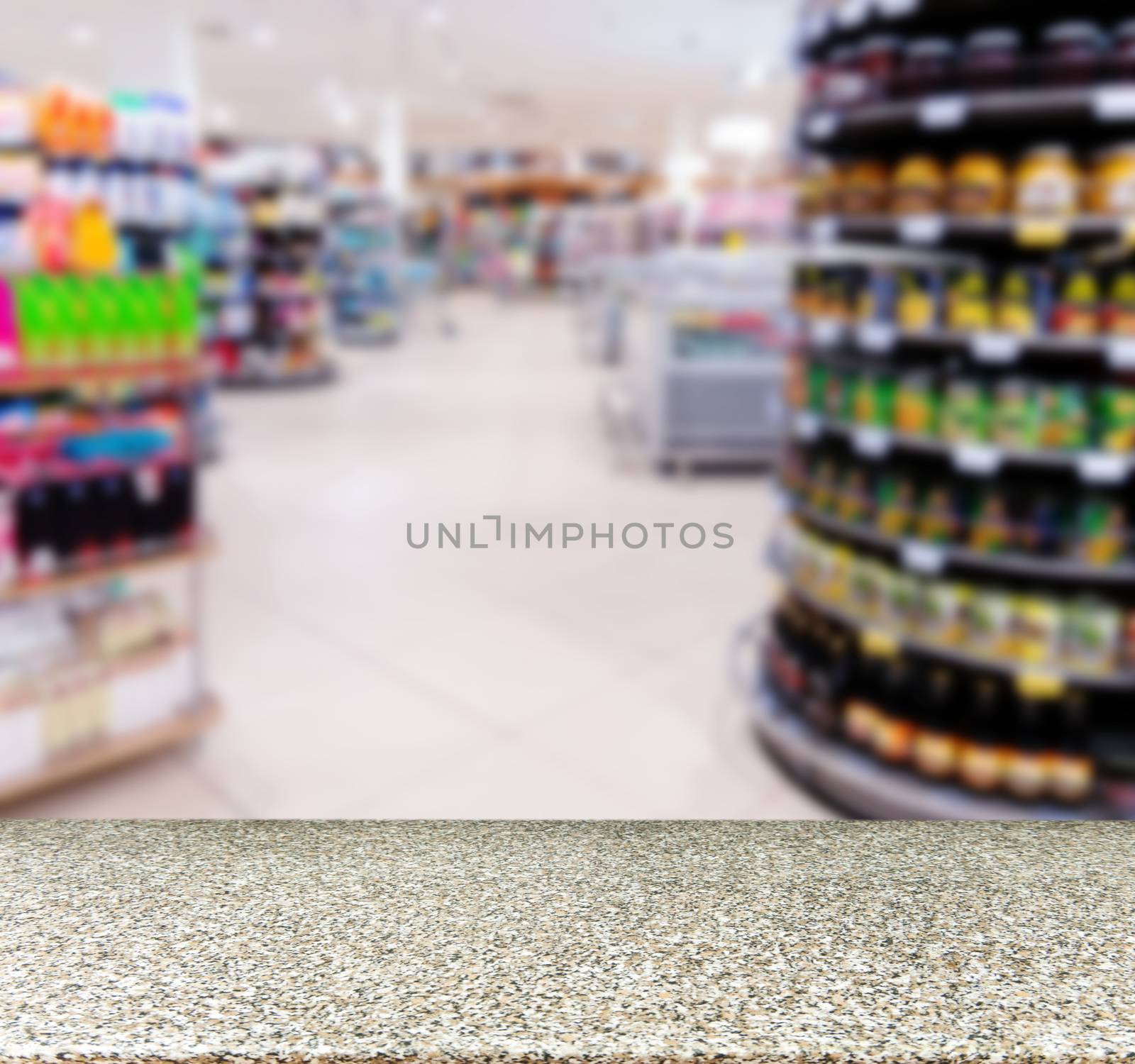 Marble board empty table in front of blurred background. Perspective marble over blur in supermarket - can be used for display or montage your products. Mock up for display of product.