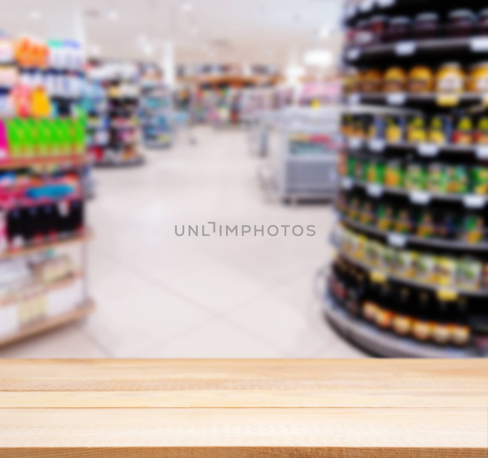 Wooden board empty table in front of blurred background. Perspective light wood over blur in supermarket - can be used for display or montage your products. Mock up for display of product.