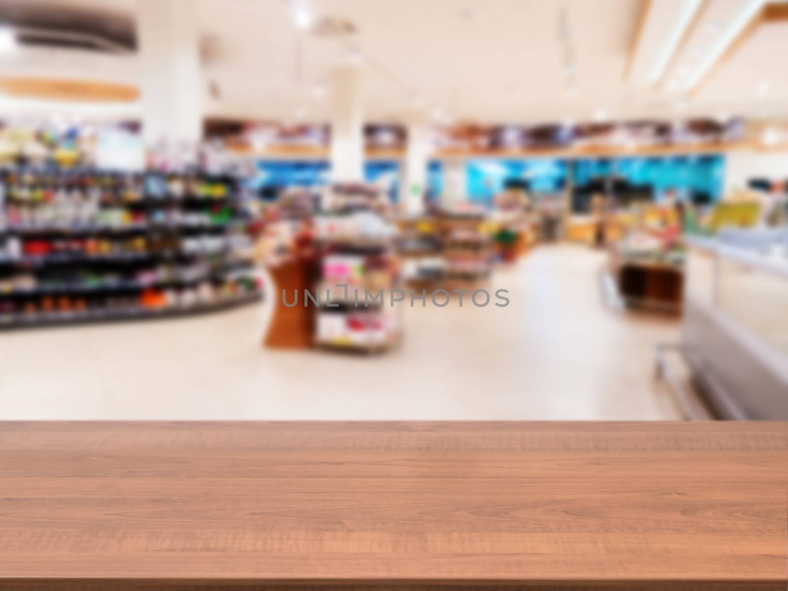 Wooden board empty table in front of blurred background. Perspective dark wood over blur in supermarket - can be used for display or montage your products. Mock up for display of product.