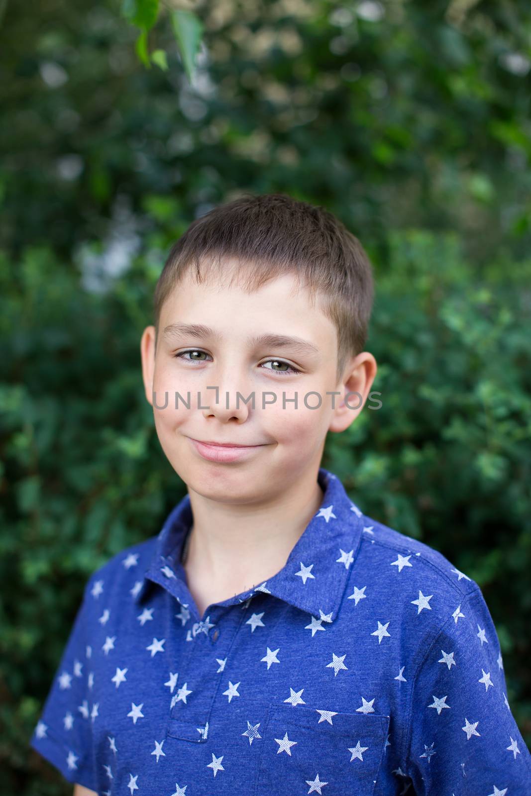 Portrait of a boy close up in nature