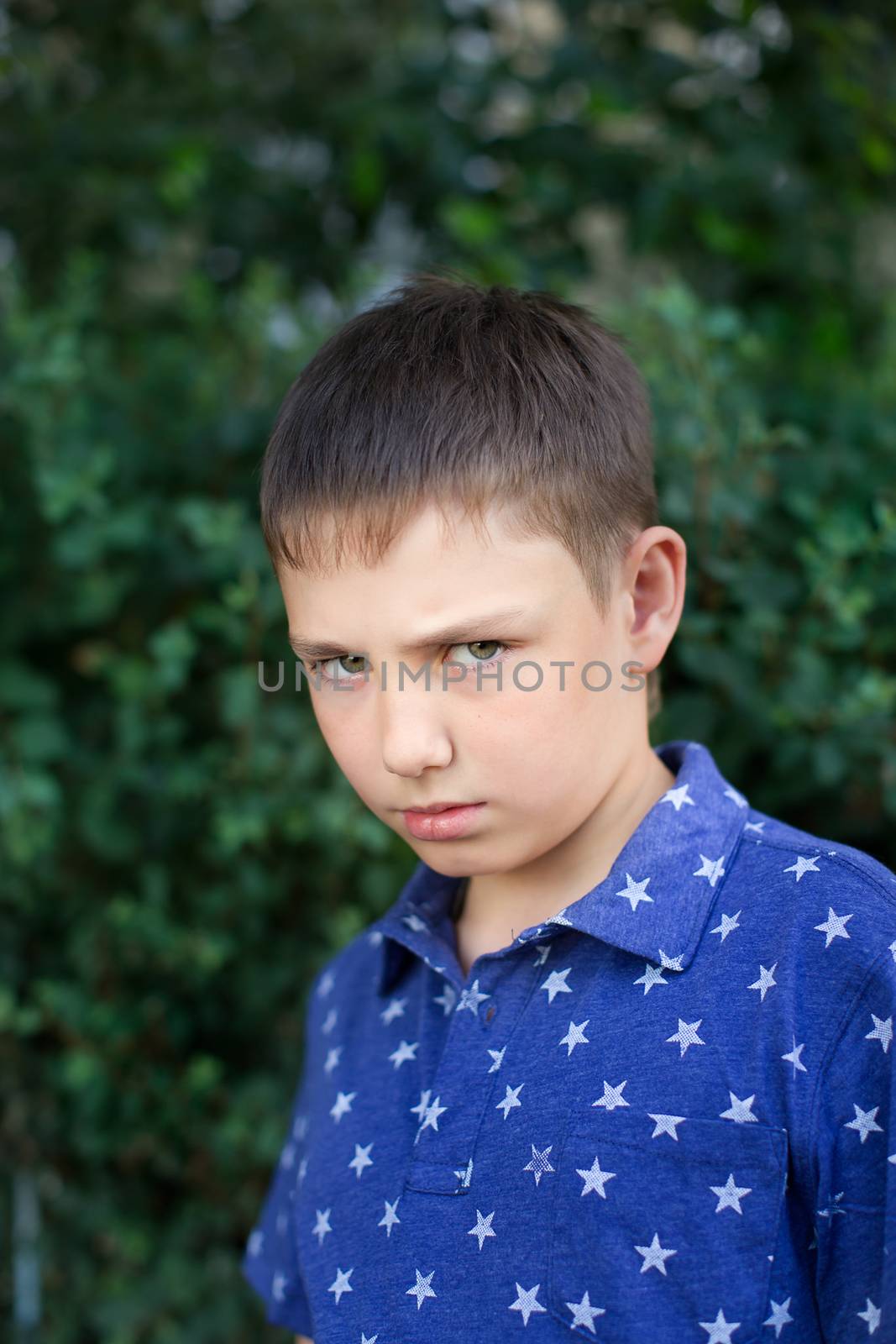 Portrait of a boy close up in nature