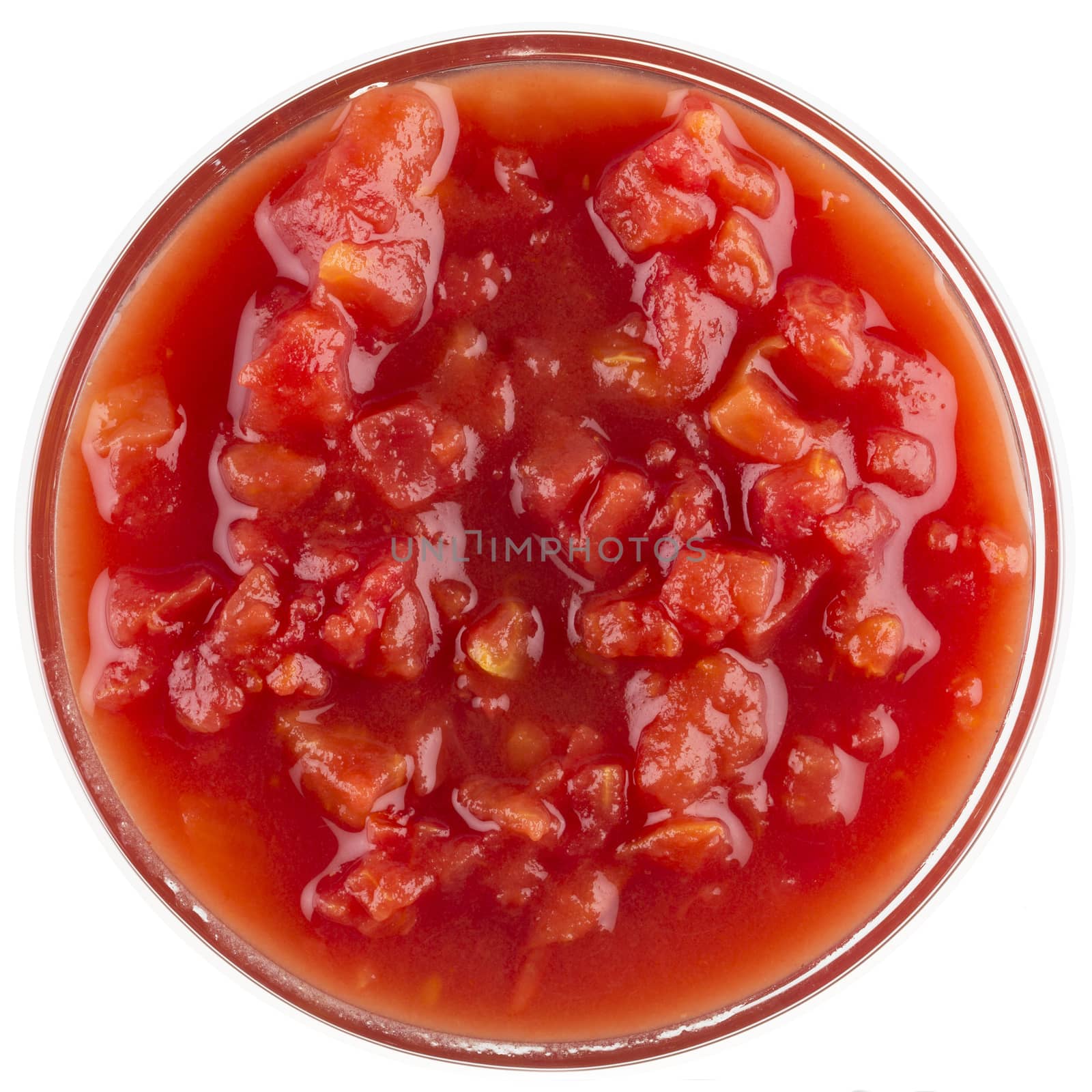 Bowl of stewed tomatoes in a bowl isolated on white.  View from above.