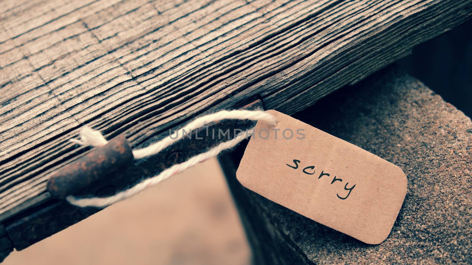 Sorry background on wooden in vintage style, sorry text is message when make hurt for someone