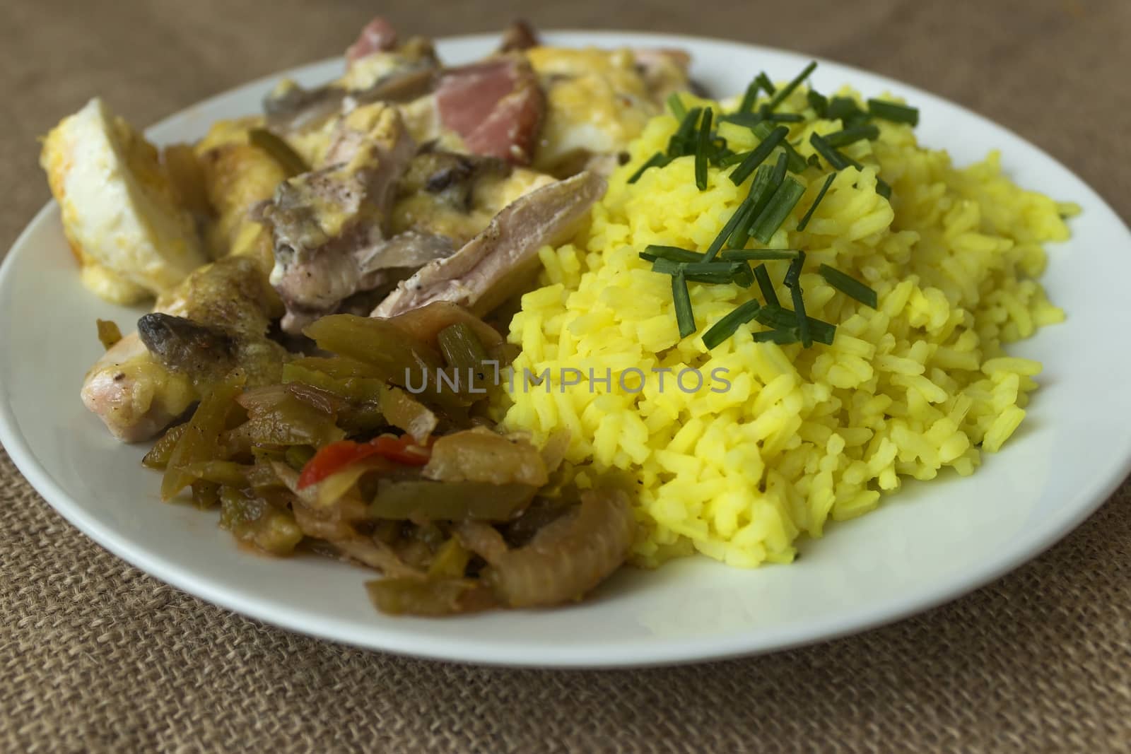 picture taken January 16, 2016 Jablonec nad Nisou, Czech Republic baked chicken with rice and pickles on a white plate light background