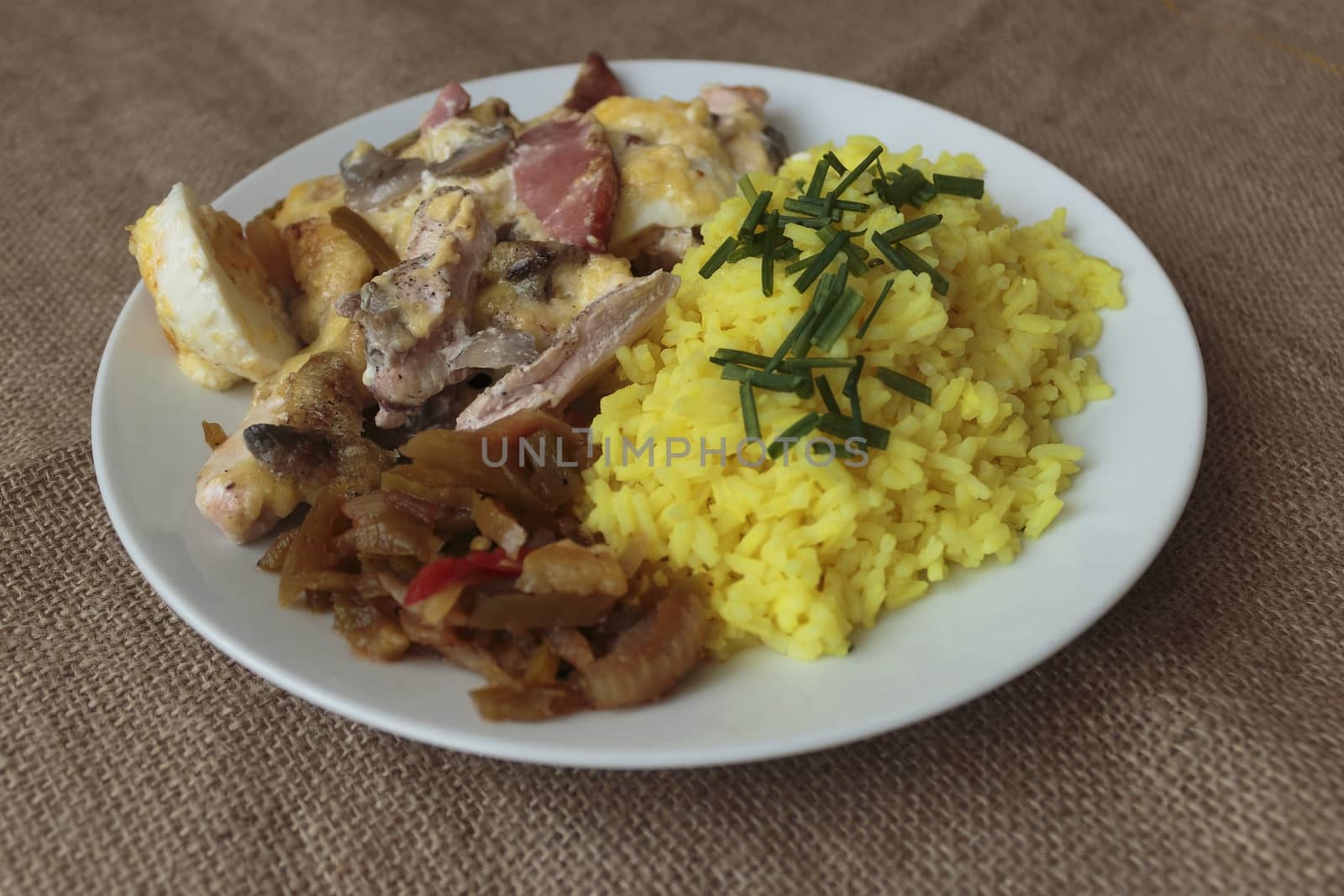 picture taken January 16, 2016 Jablonec nad Nisou, Czech Republic baked chicken with rice and pickles on a white plate light background