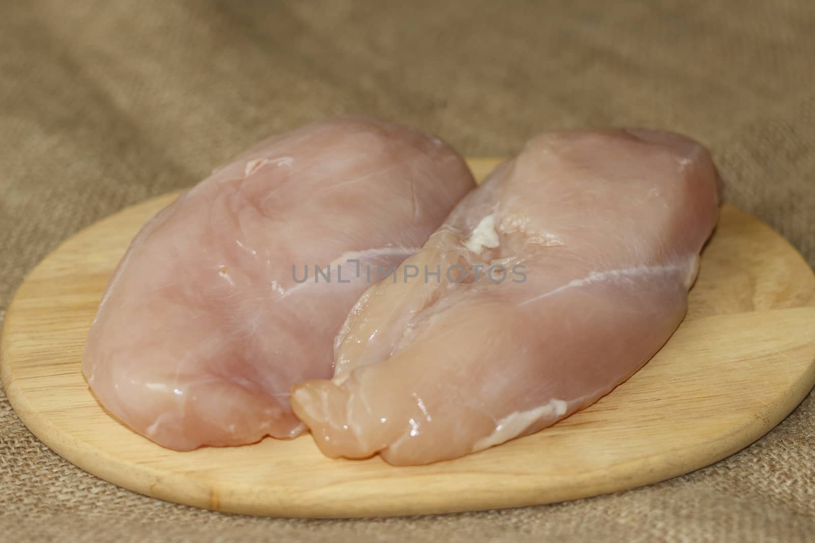 picture taken January 16, 2016 Jablonec nad Nisou, Czech Republic chicken breast on a cutting board bright background