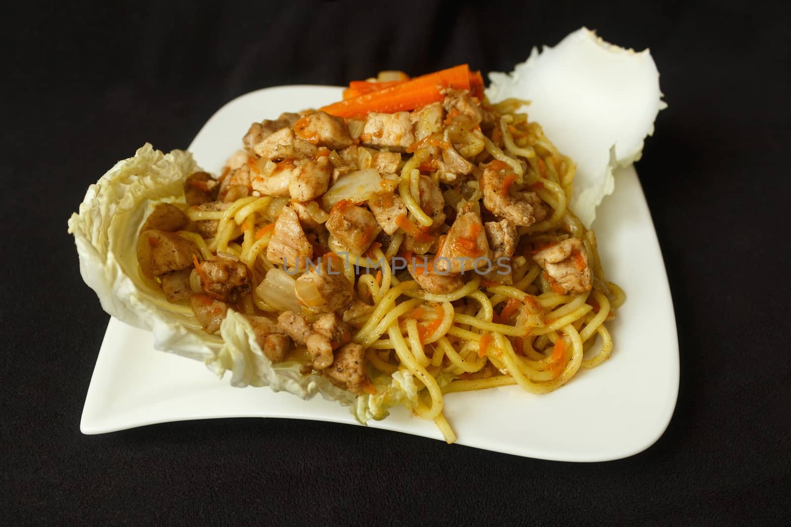 Taken 15. January 2016 Jablonec above Nisou, Czech Republic china noodle chicken meat odds grated carrot, odds cabbage to leaf Chinese cabbage white plate dark background