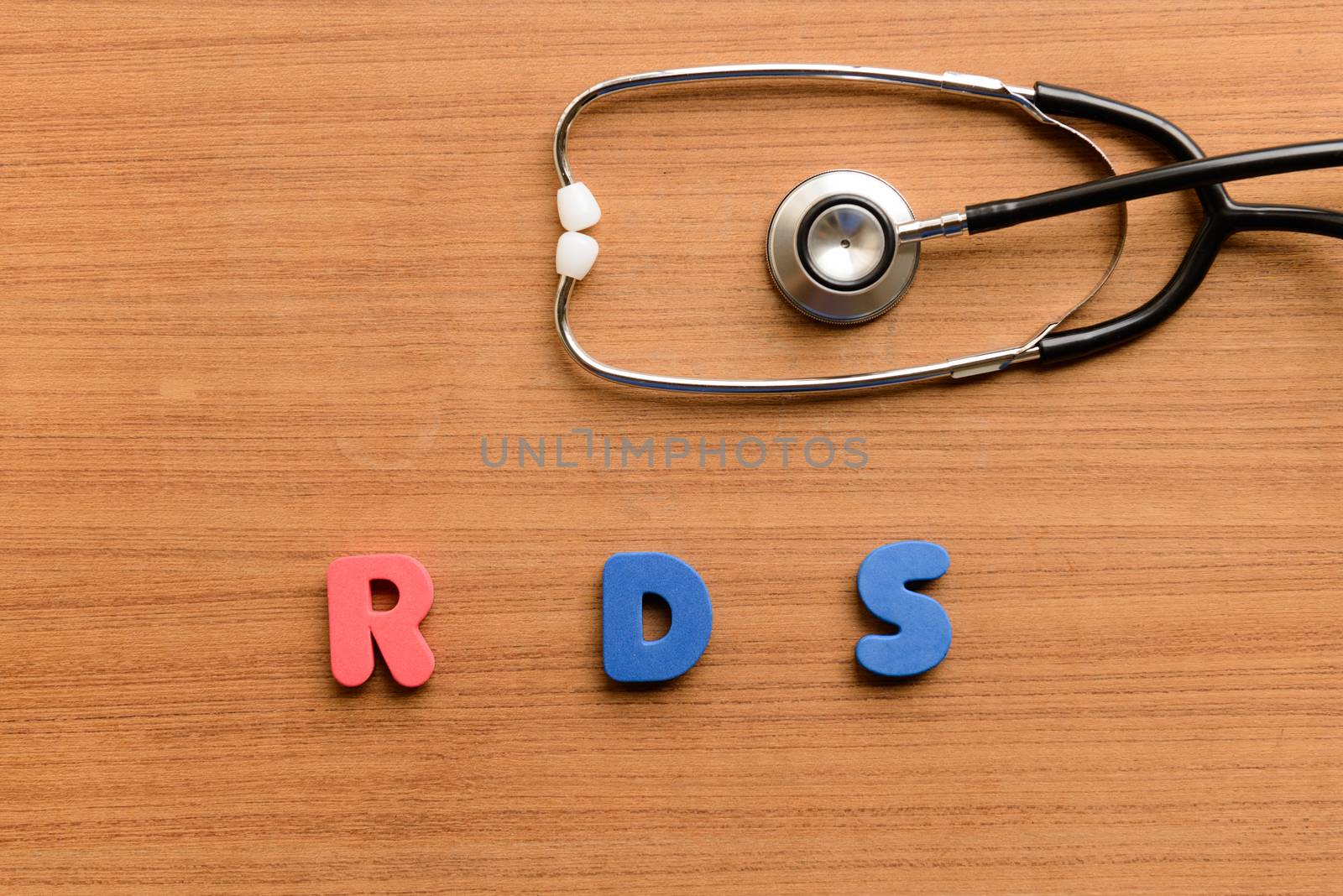 Respiratory distress syndrome (RDS) colorful word on the wooden background