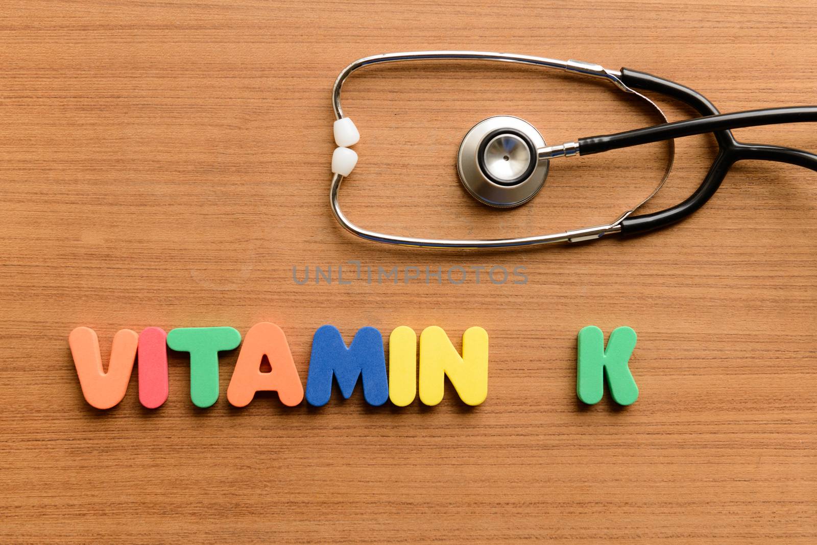 Vitamin K colorful word on the wooden background