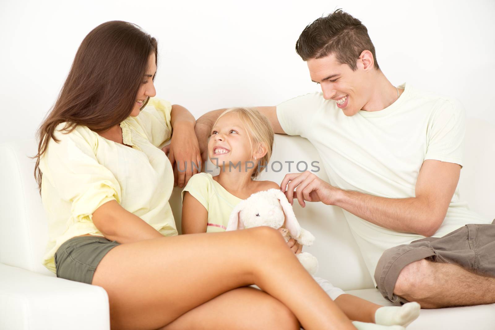 Portrait of a beautiful Happy family sitting at home and talking