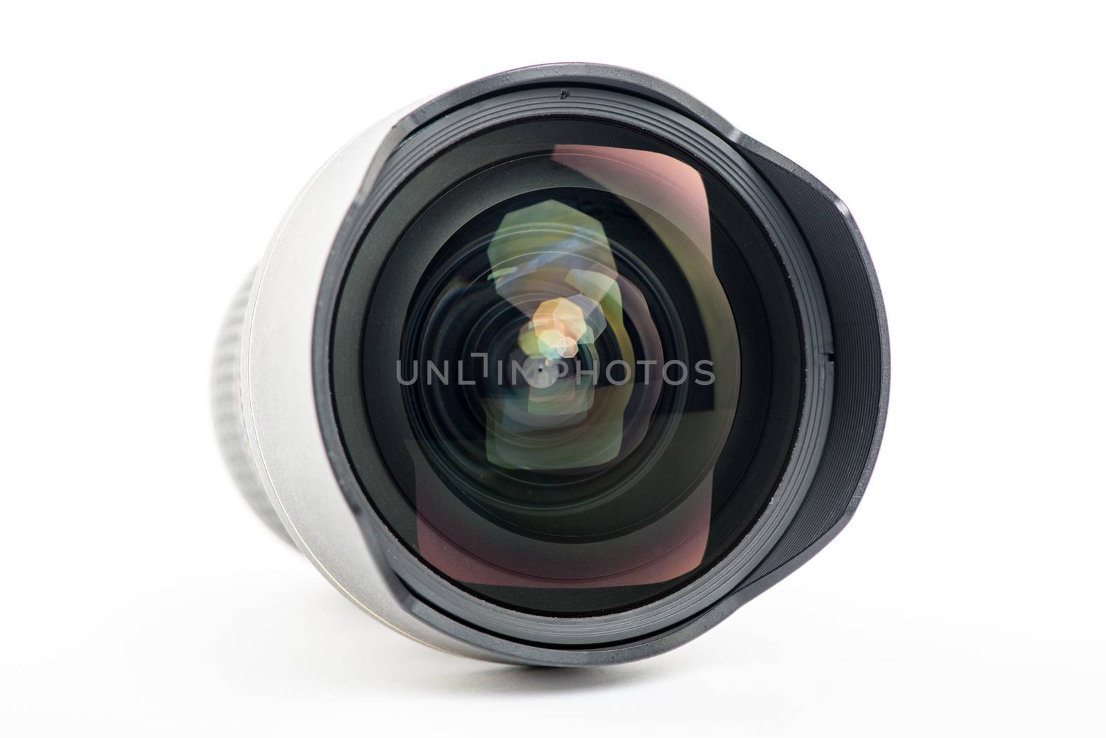 Close-up of a camera lens on white background