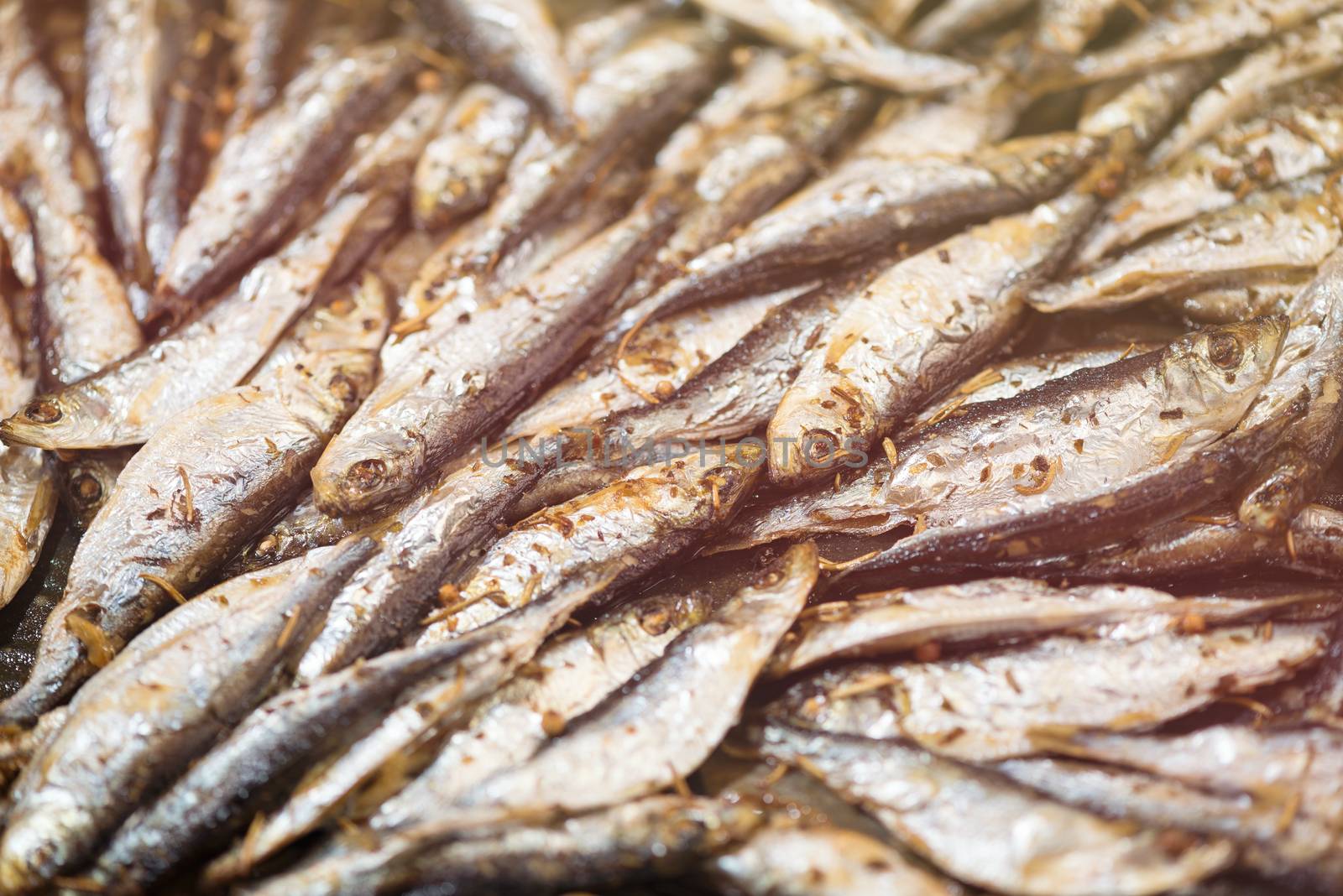 Fresh crispy fried Smelts in the pan. Close-up.