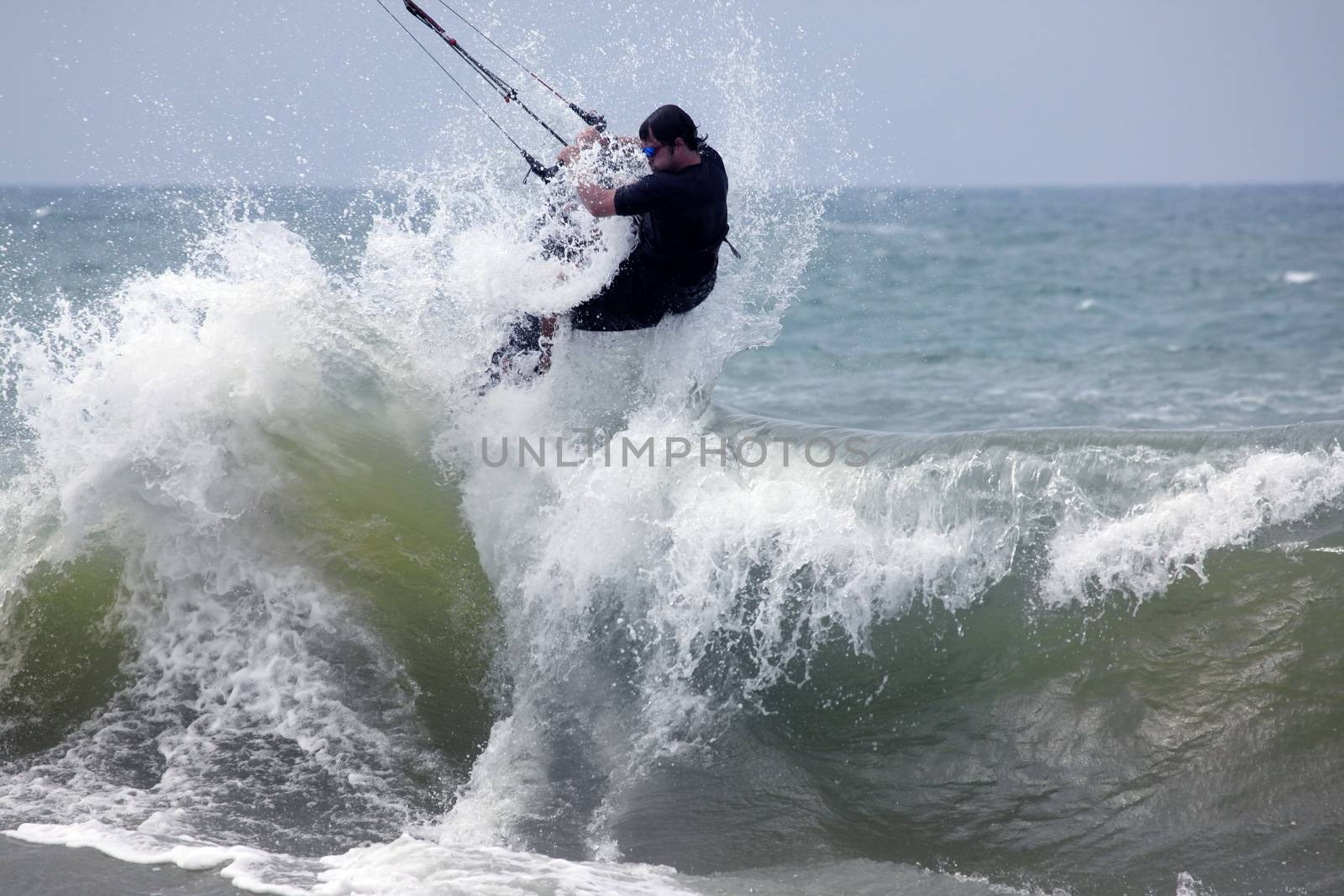 Kiteboarder enjoy surfing in ocean. Vietnam