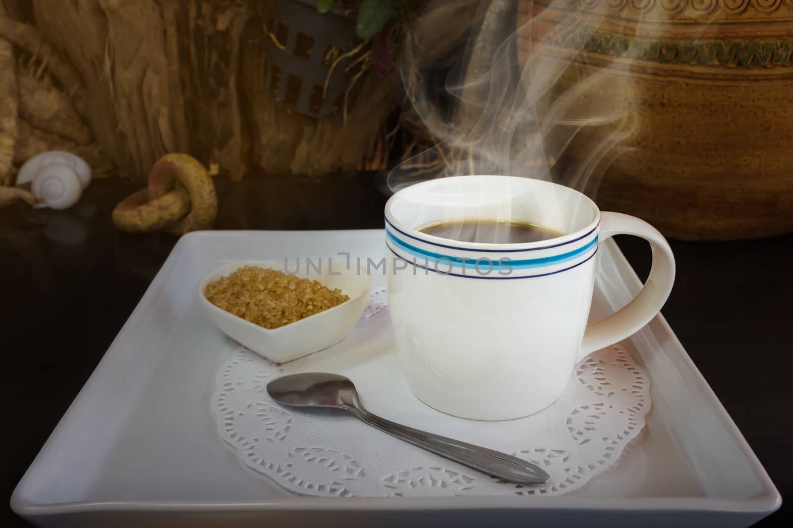 Big white cup of hot black coffee with sugar in still-life colour tone, classic simply black coffee on white tray