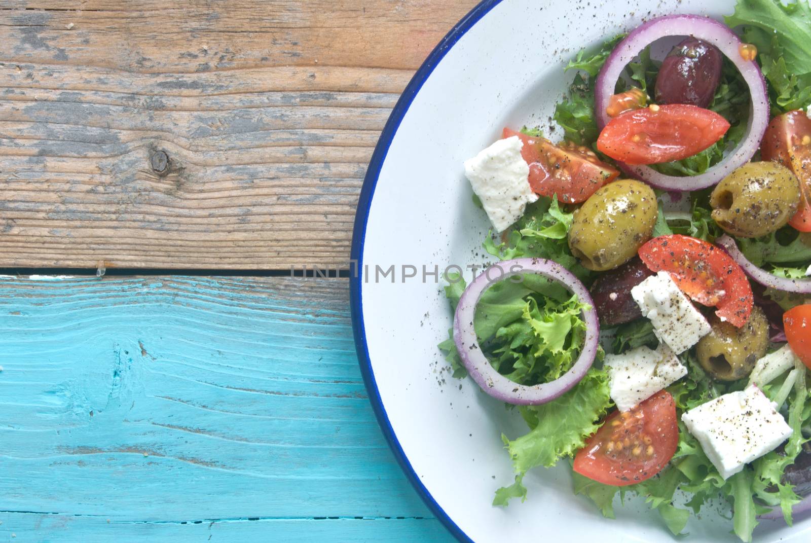 Plate of freshly made salad with tomatoes and feta 