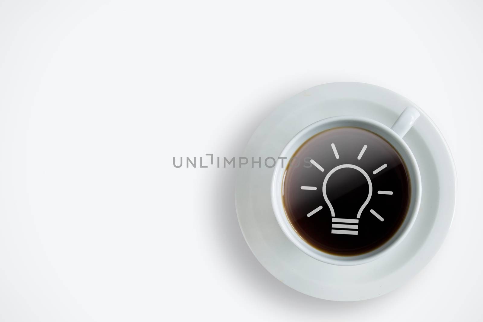 Fresh cup of coffee with idea bulb symbol in the middle 