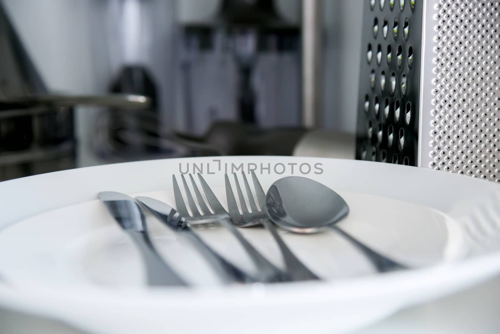 Fork, Spoon and Table Knife on the white background by vlaru