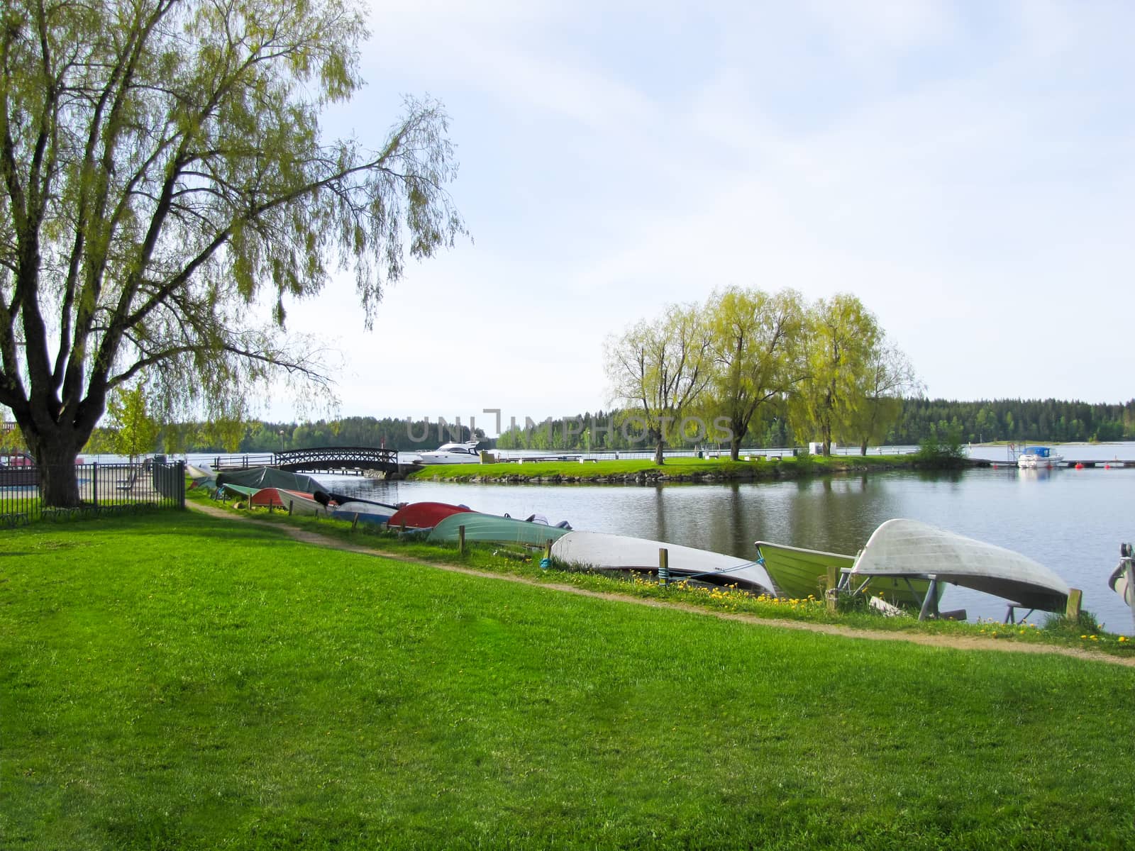 the Bank of the river with a small dock and overturned boats