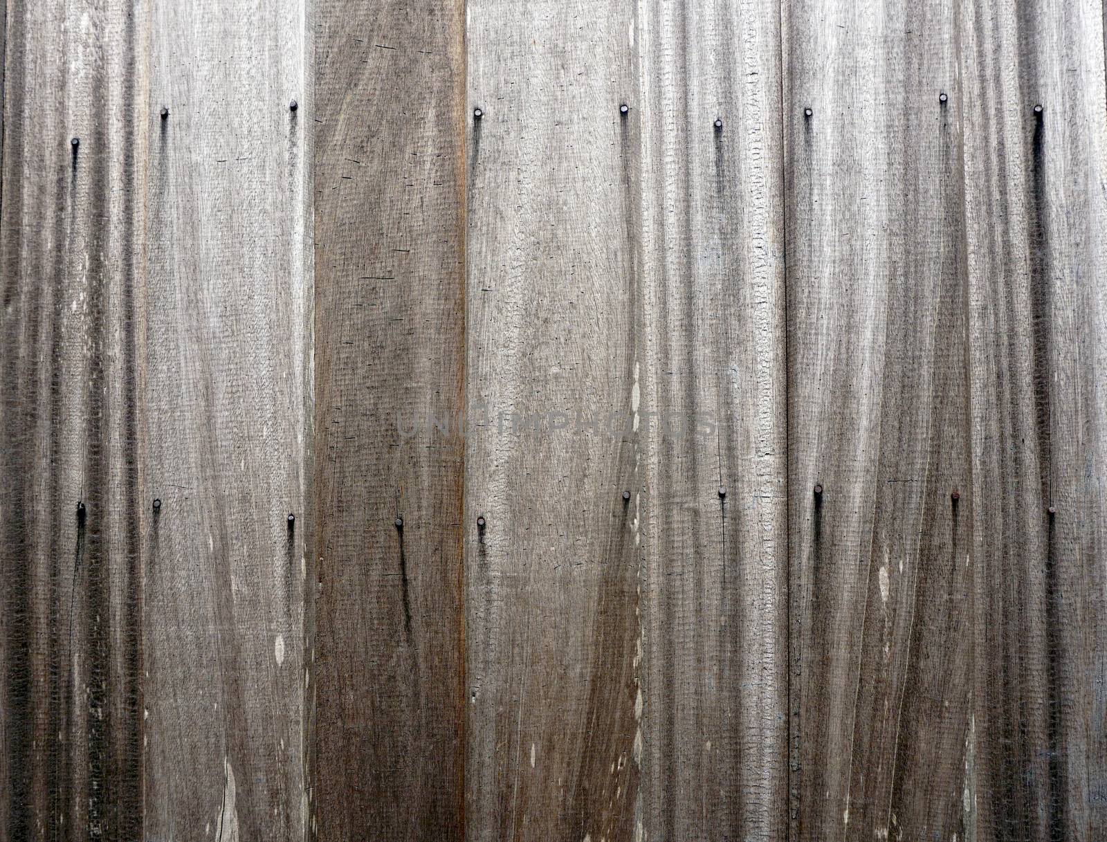 Wooden strips wall with rivets vernecular outdoor material             