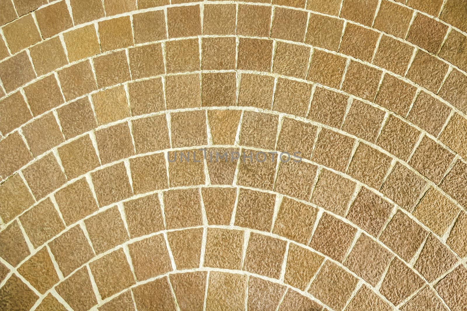 Close up circular brown brick paving pattern
