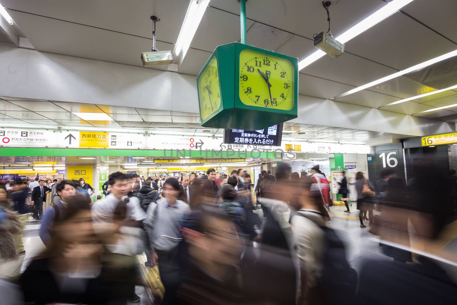 Crowd of people during rush hour on Tokyo metro.