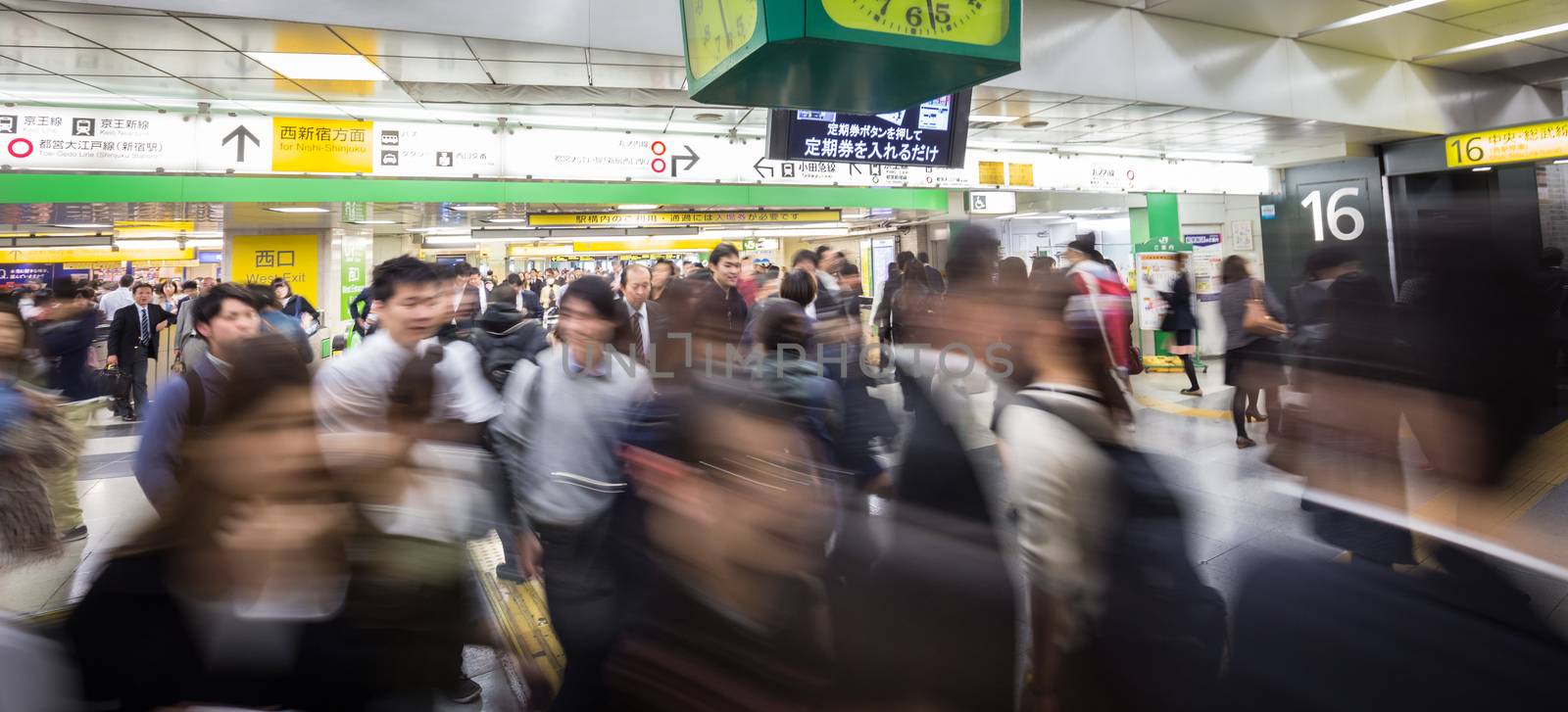 Crowd of people during rush hour on Tokyo metro.