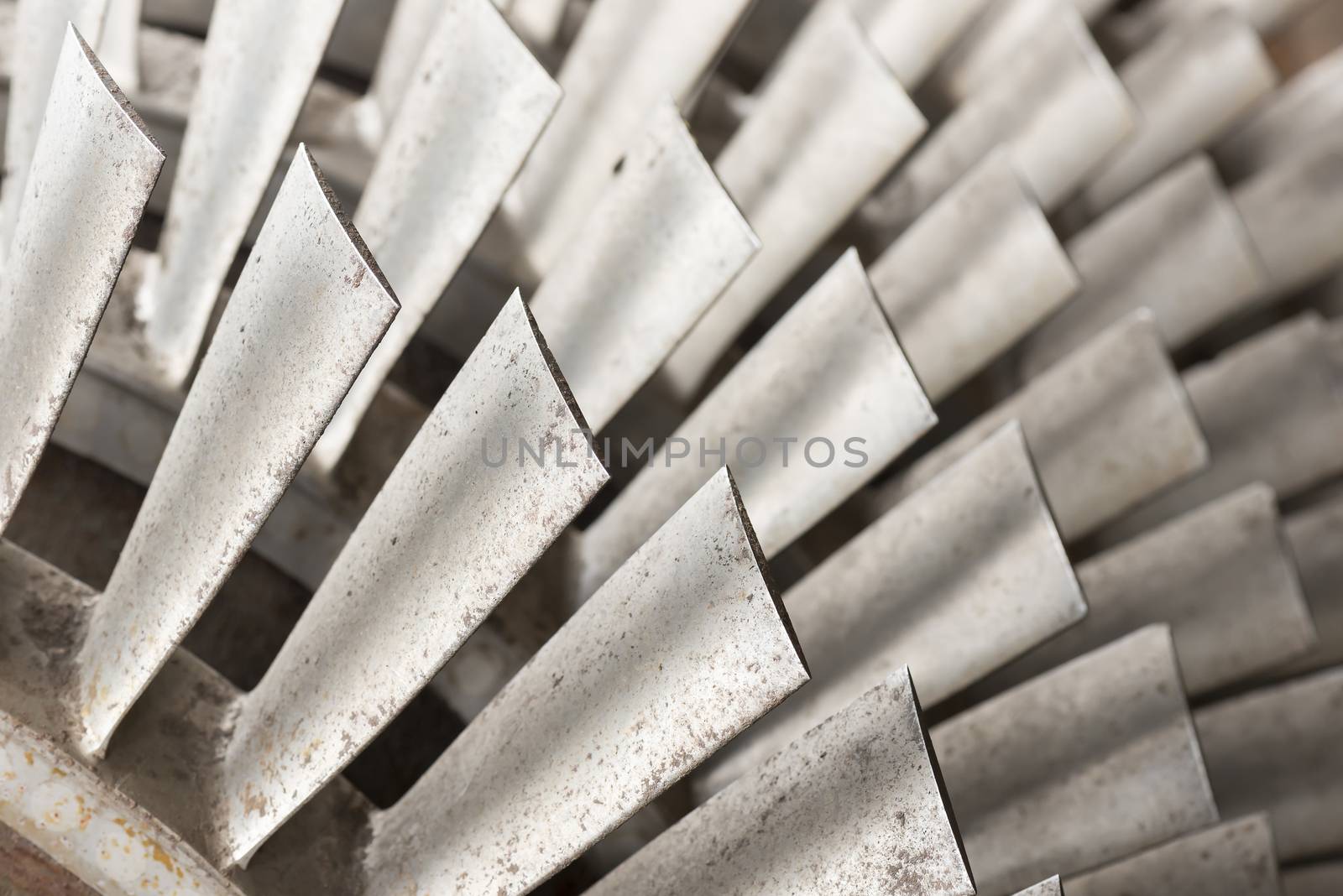 Industrial metal turbine blades in an old factory
