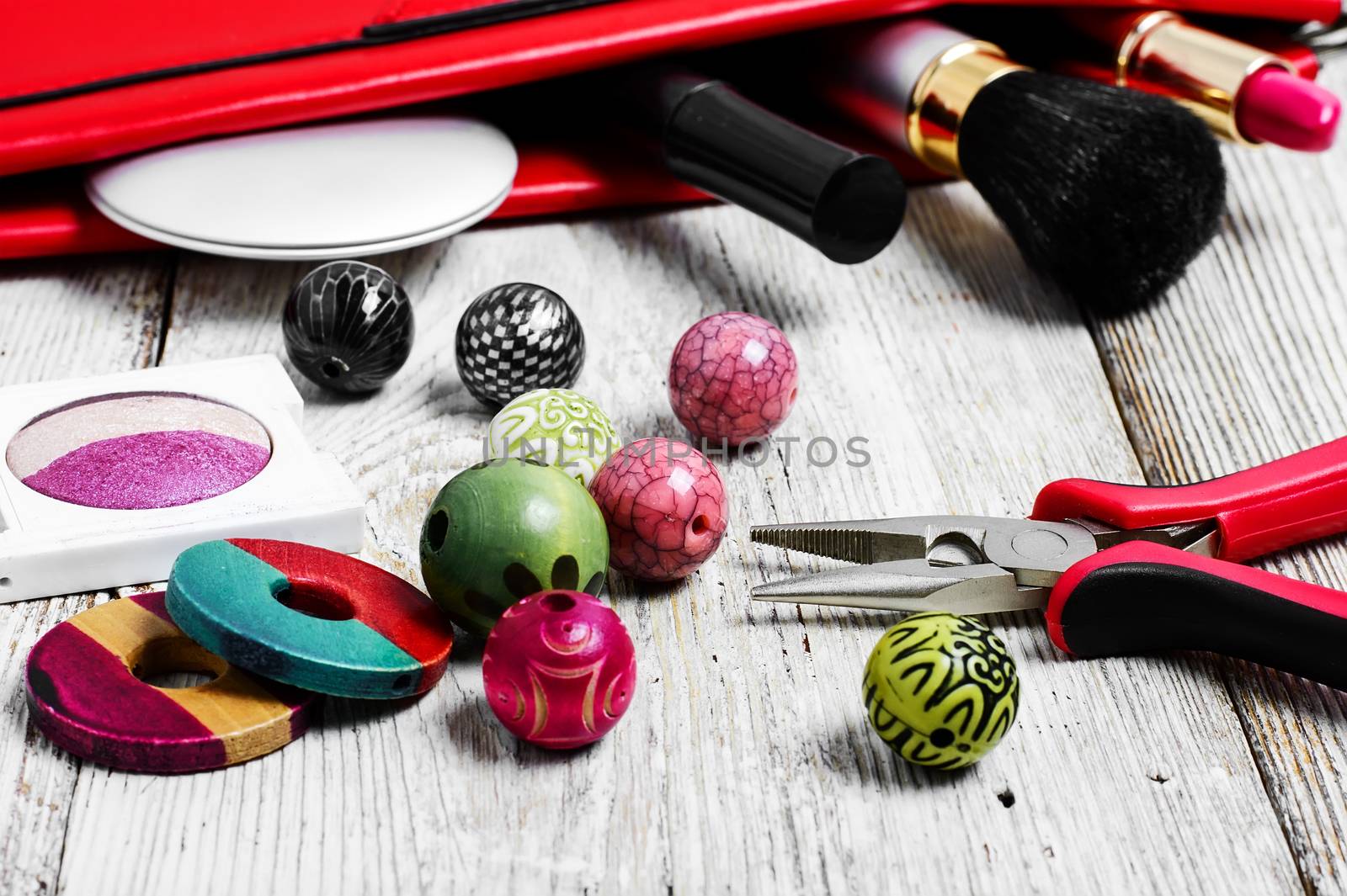 Set of beads for jewelry and womens tote bag with cosmetics