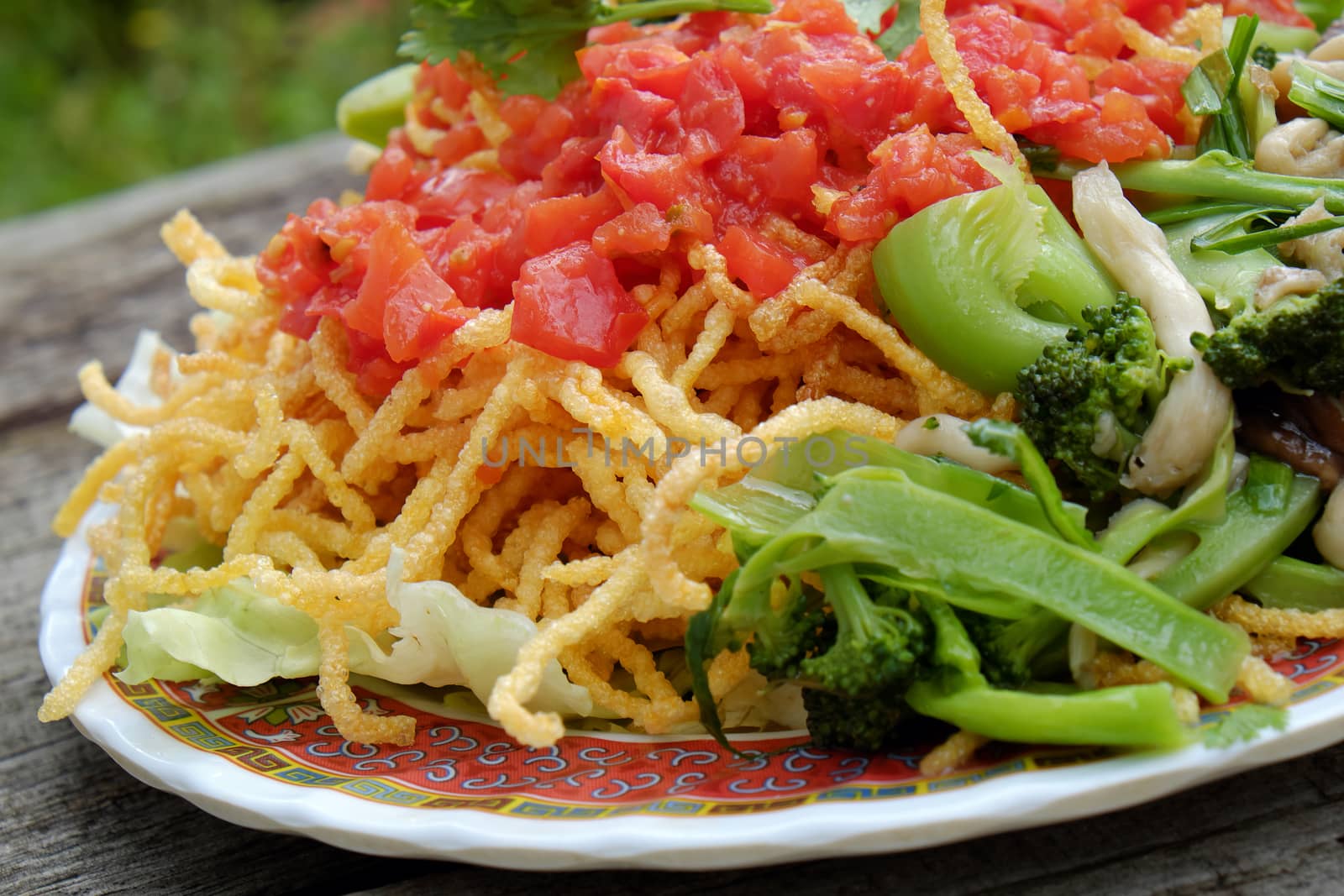 Vietnamese food, vegetarian eating from noodle with vegetable, meal for diet, rich fiber, colorful on plate with tomato, cabbage, mushroom, cauliflower