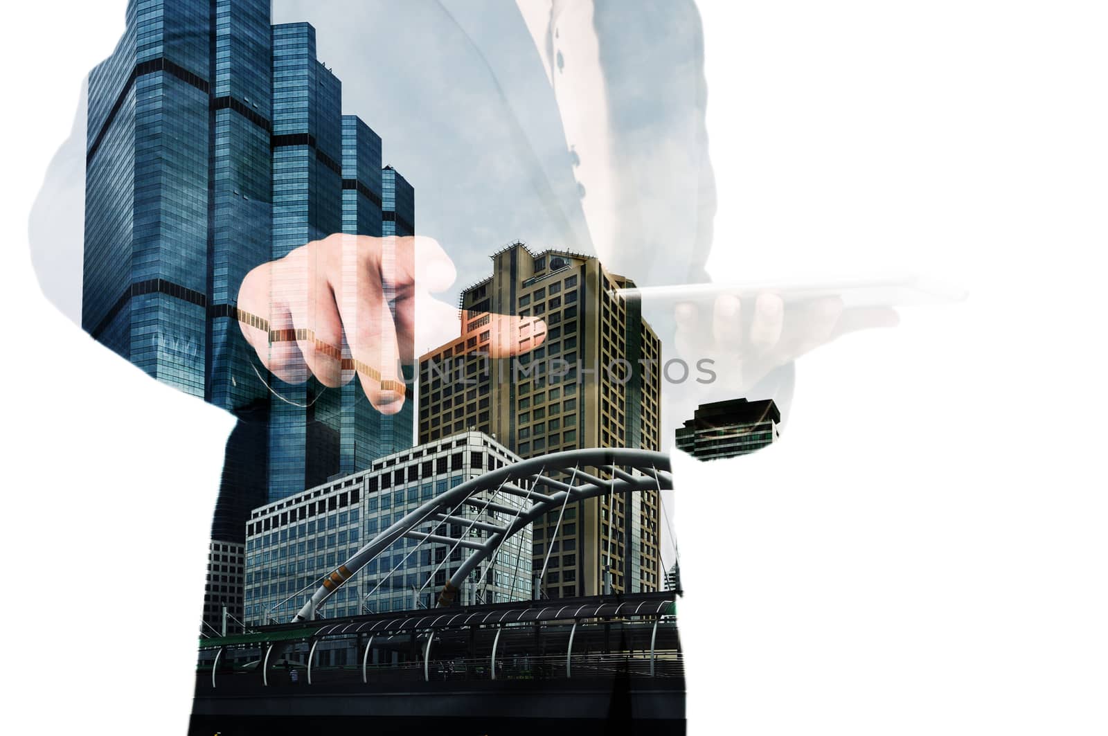 Double exposure of a businessman and a city using a tablet over  by thampapon