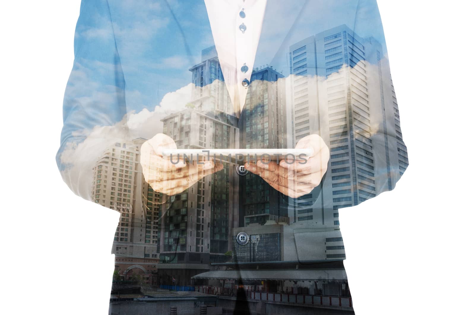 Double exposure of a businessman and a city using a tablet over white background as Business Technology Concept