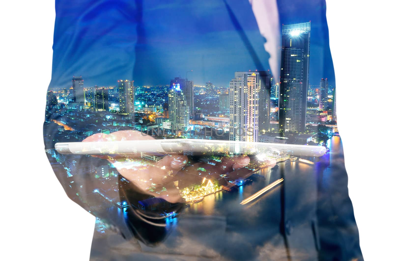 Double exposure of Night city and business man using digital tablet device as Business development concept.