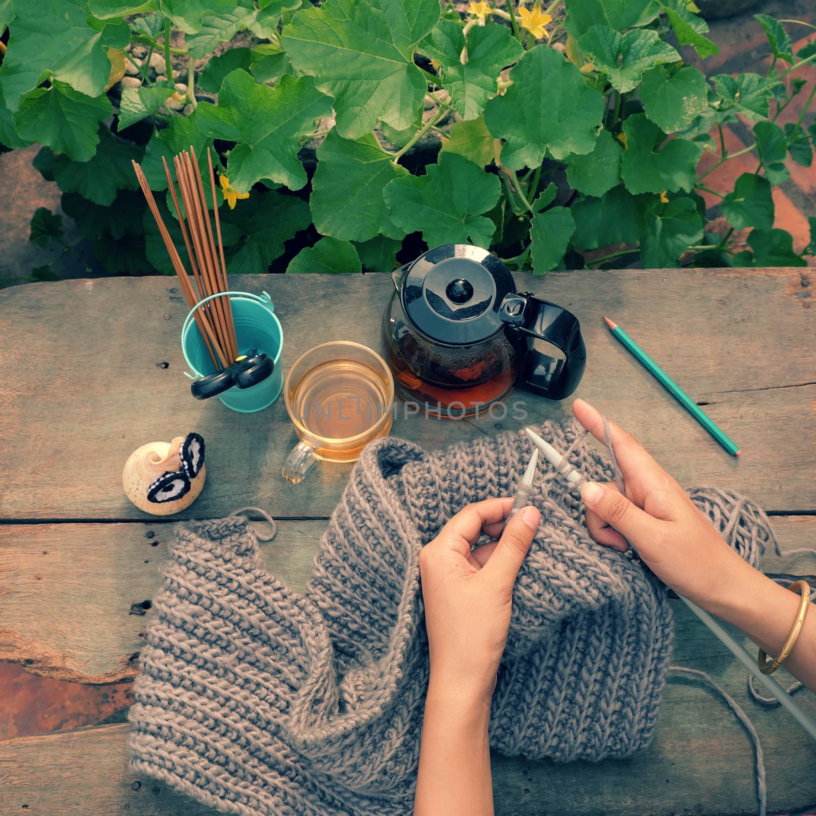 Knit man scarf for cold day in winter, hobby leisure with handmade gift for father day, woman hand knitting from yarn, nice present in vintage color