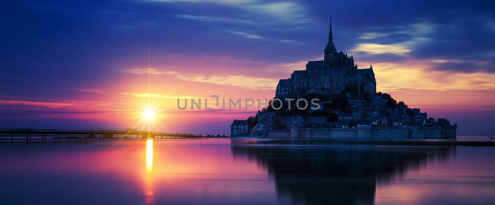 Panoramic view of Mont-Saint-Michel at sunset, France.