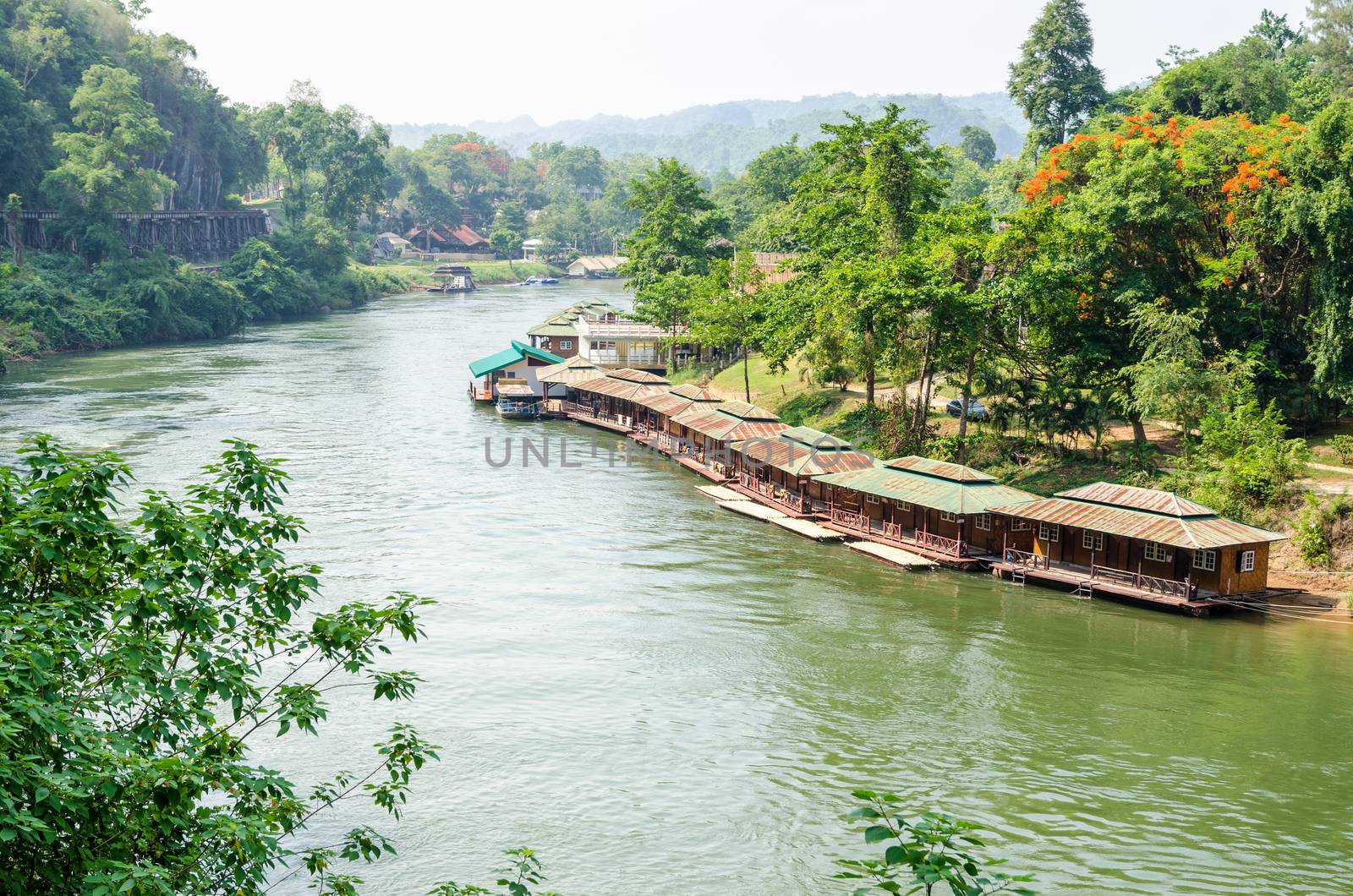Beautiful landscape Kwai Noi river under Death Railway bridge and floating resort at Krasae cave in Kanchanaburi province Thailand